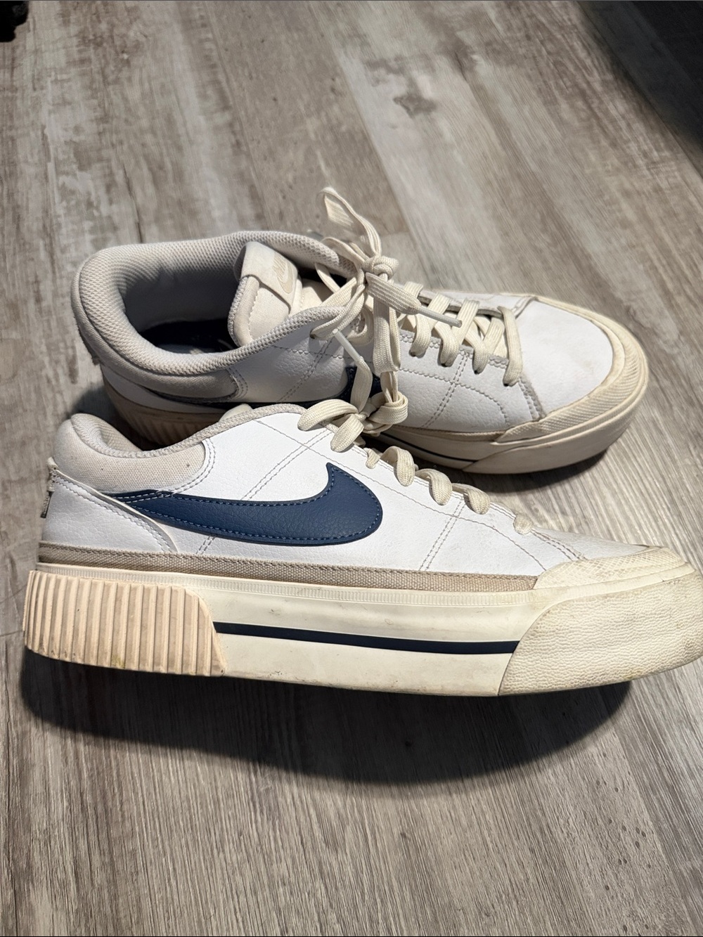 Nike womens White Low-Top Sneakers with Blue Swoosh and Cream Sole